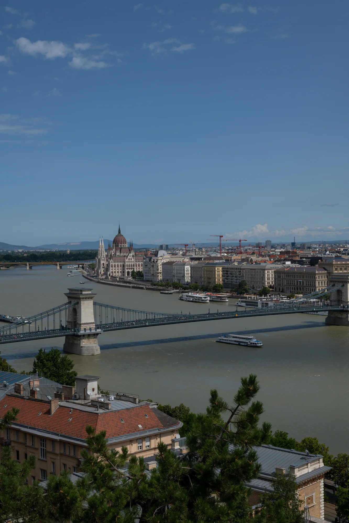 Vertical view of the Chain Bridge across the Danube, with Parliament farther upstream on the Pest bank in Budapest.
